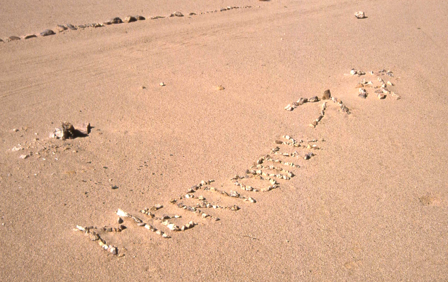 AlgeriaSahara-Tracks-SignpostingTownInDesertTrackWithStones-%5E-c34r.jpg
