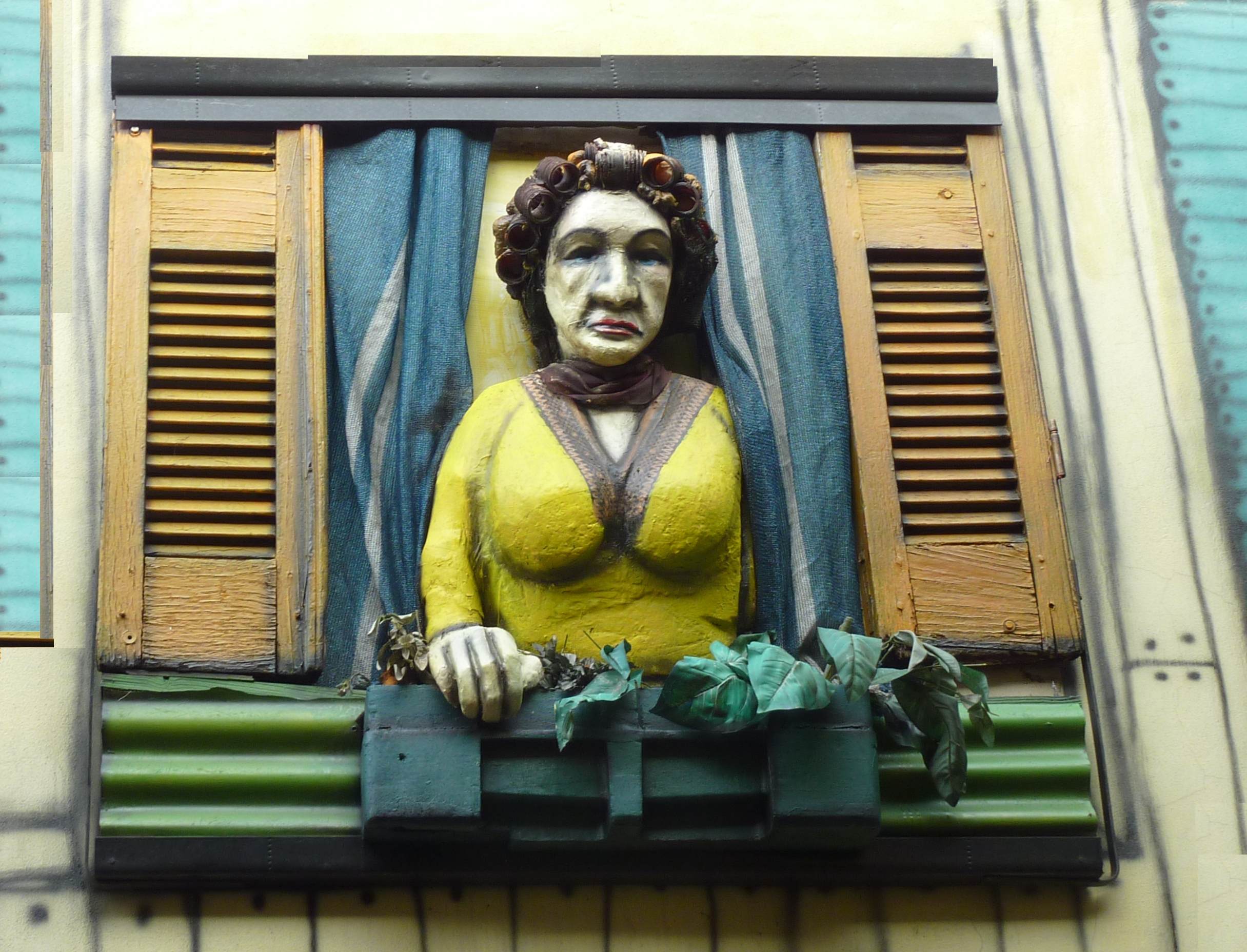 ArgentinaBA-LaBoca-SculptureUnhappyWomanInWindow-0569