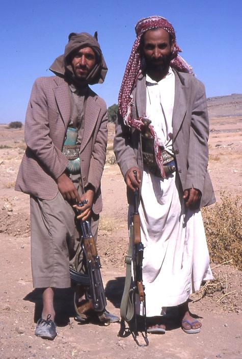 two guys with guns